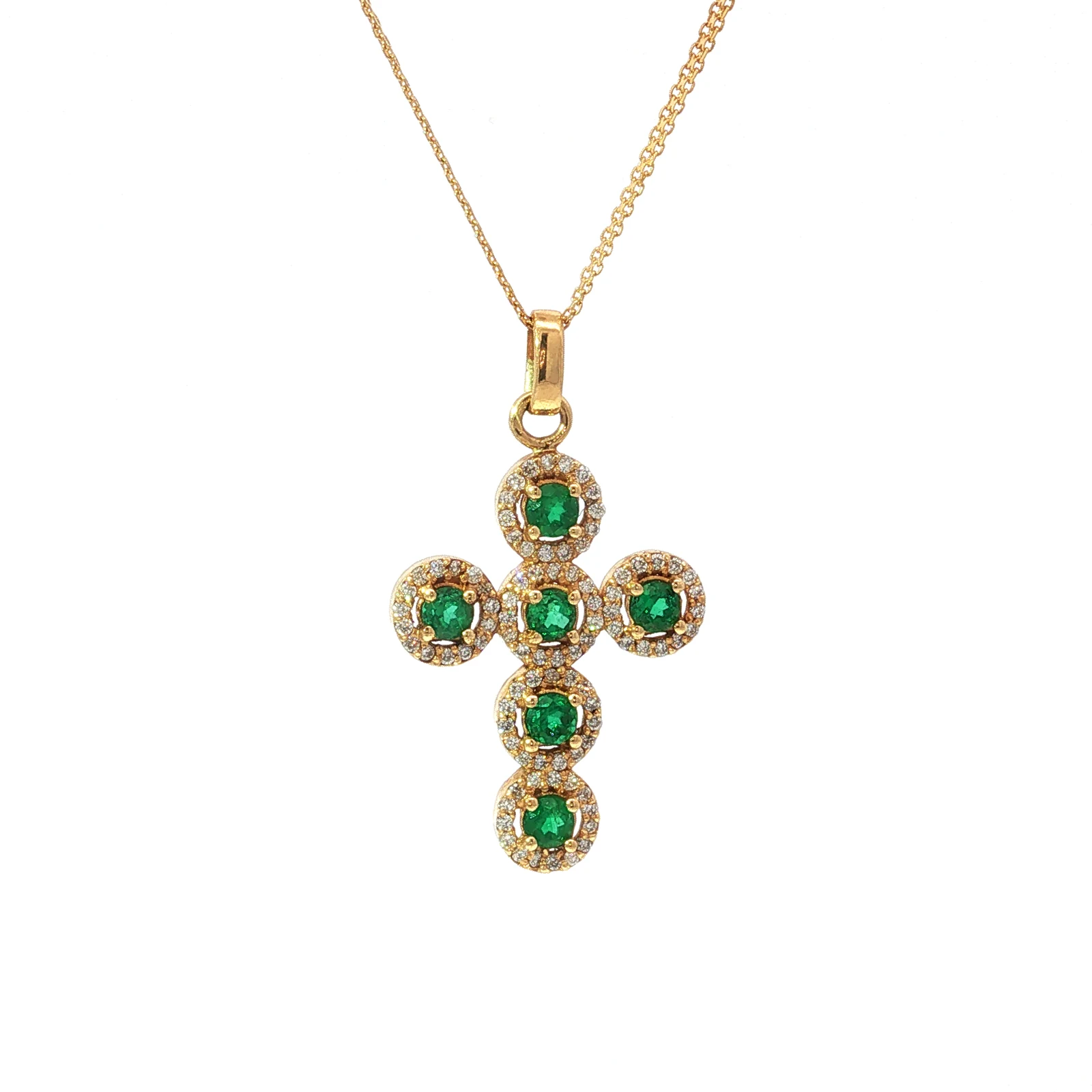 Cruz de esmeraldas con halo