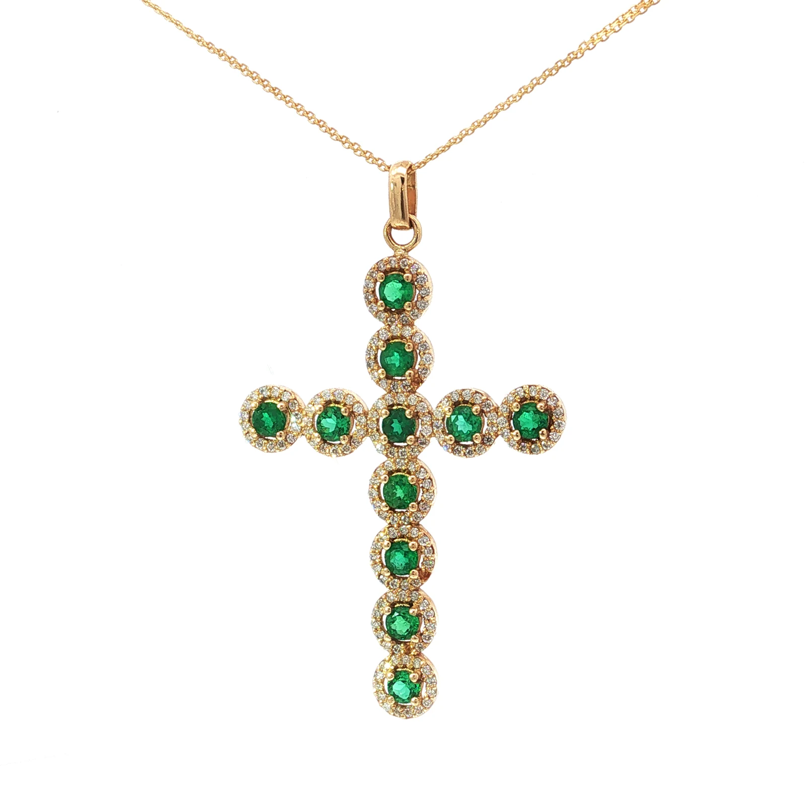 Cruz alargada de esmeraldas y diamantes